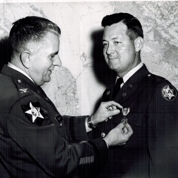 George Goodin in Military Photo right) receiving an award.