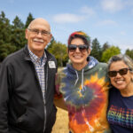 American Canyon Mayor Leon Garcia stangs with Bailie, a staffer from LGBTQ Connection, and another attendee.