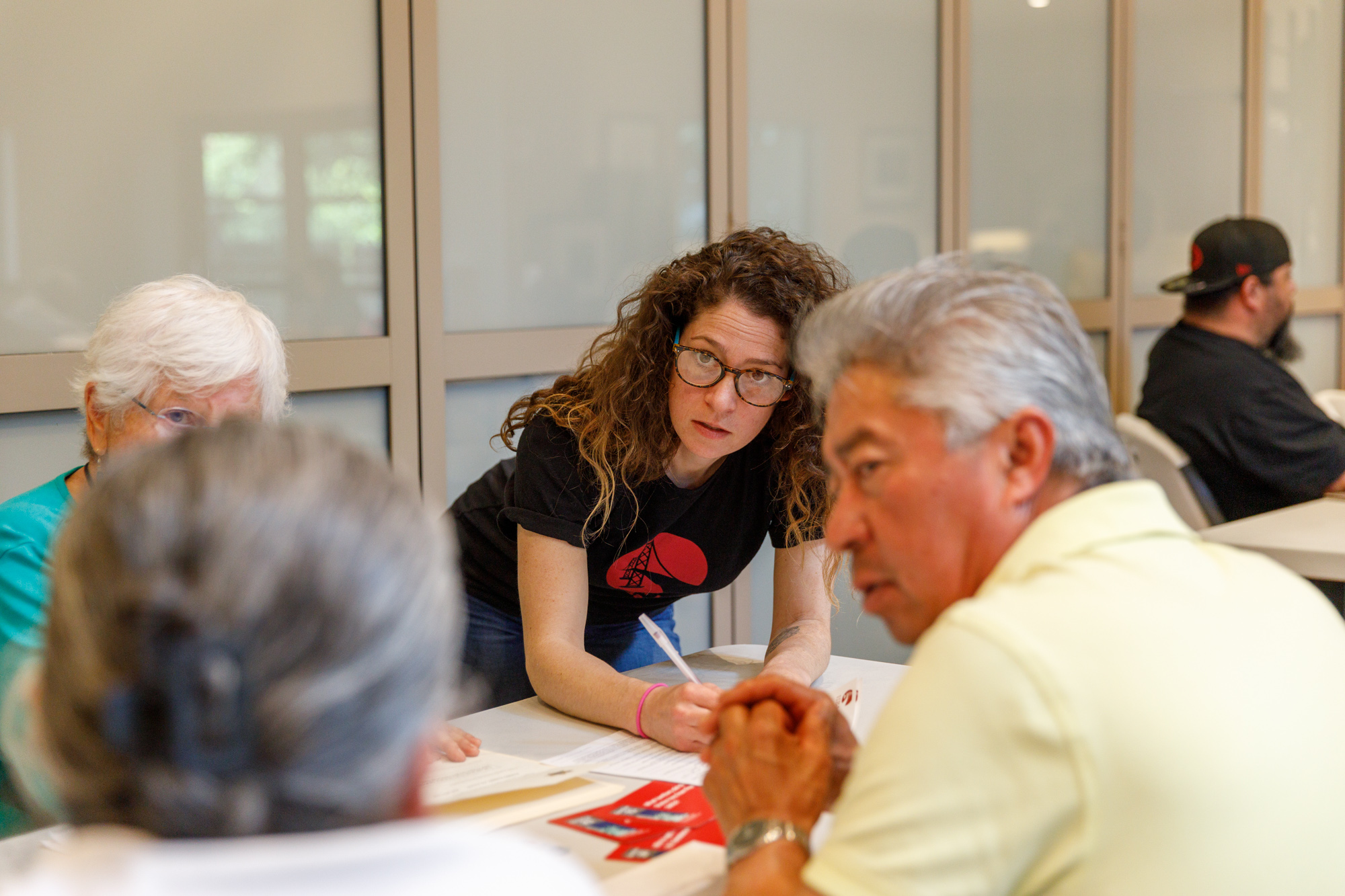 Immigration attorney Mady Hernandez talks with applicants they work to fill in U.S. citizenship applications at a citizenship workshop hosted at Congregation Beth Shalom, in Napa, Calif. The workshops are a core part of the One Napa Valley Initiative launched by Napa Valley Community Foundation in 2013. The Initiative includes four nonprofit partner agencies who collaborate to host monthly citizenship workshops, and offer U.S. History and Civics classes to residents who are eligible for U.S. citizenship.