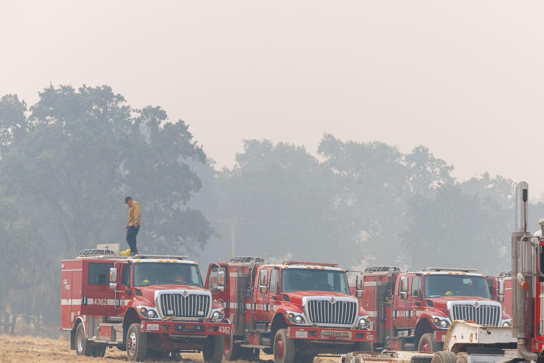Firefighters from multiple departments stage in Pope Valley near Aetna Springs Road and Pope Valley Roads.